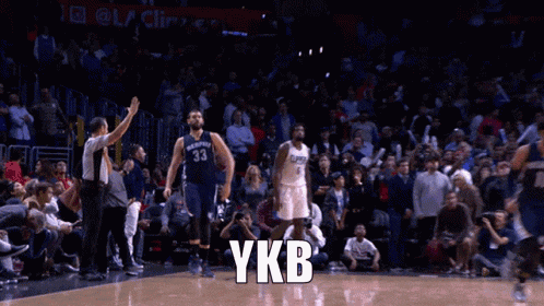 a basketball player with the number 33 on his jersey is jumping up in the air