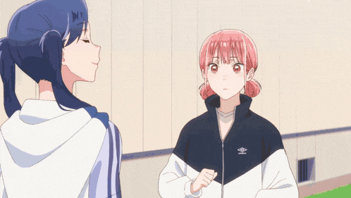 two anime girls are standing next to each other and one of them is wearing an umbro jacket