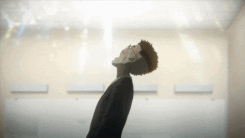 a man in a suit is looking up into the air