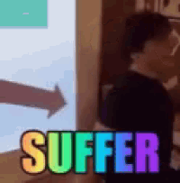 a woman is standing in front of a projection screen with the word suffer in rainbow colors