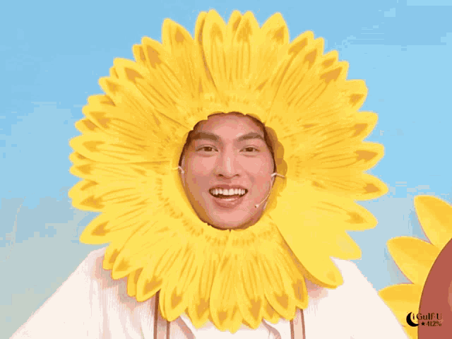 a man is wearing a sunflower hat with a microphone on it