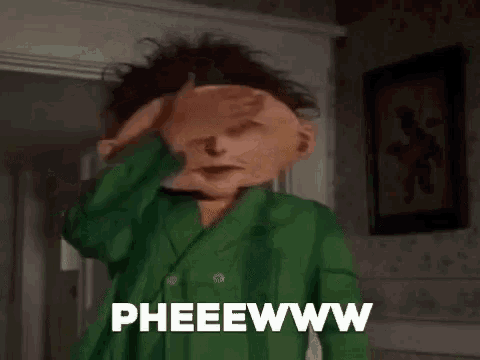 a cartoon character with a big head is standing in front of a door and says pheeewww .