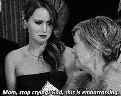 a woman in a black dress is crying while talking to another woman .