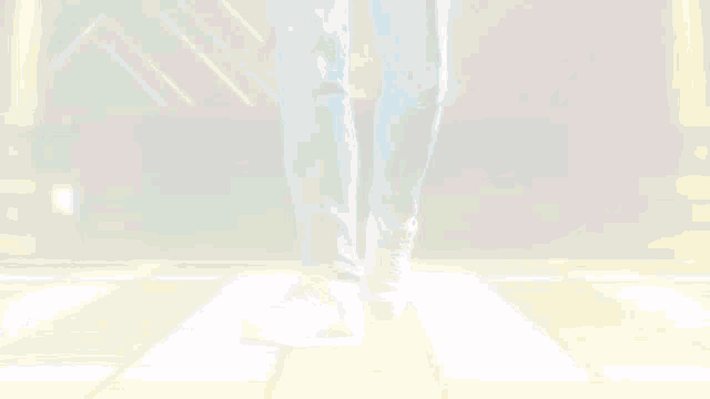 a pixelated image of a person 's feet dancing