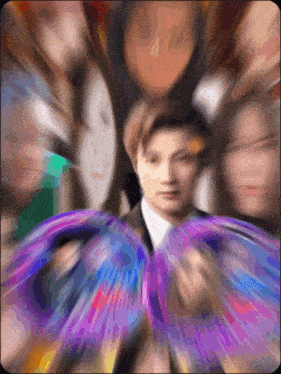 a blurry picture of a man in a suit and tie
