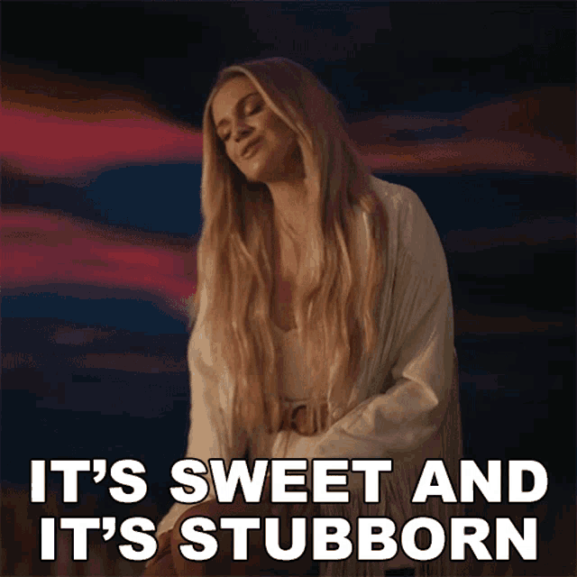 a woman says it 's sweet and it 's stubborn in front of a cloudy sky