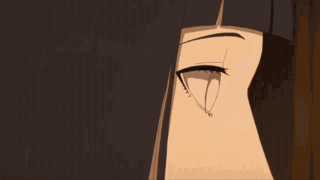 a close up of a girl 's eyes with a very dark background