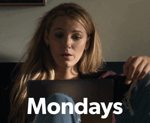 a woman sitting on a couch looking at a laptop with the word mondays written on the bottom