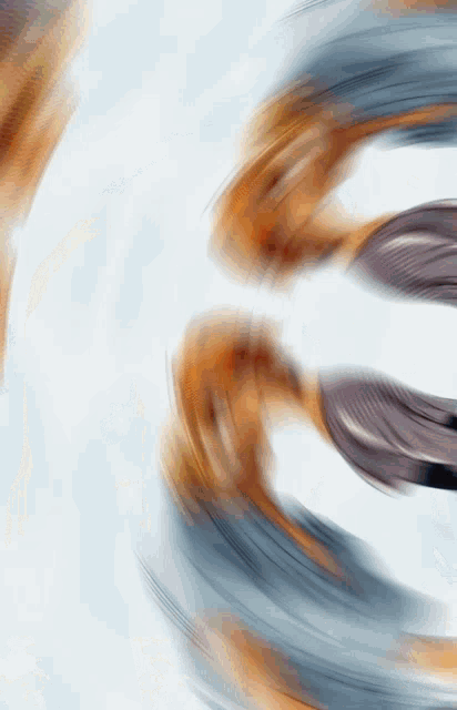 a blurred image of a person 's face with the number 3 in the center
