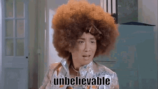 a woman with an afro has the word unbelievable written on her face