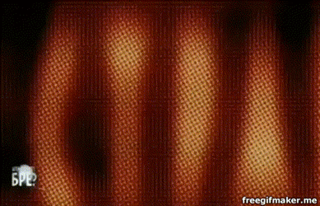 a blue ball is floating in the air on a red and yellow curtain .