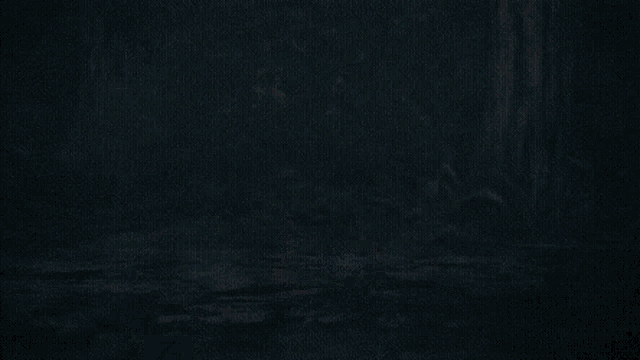 a person is flying through the air with a sword in their hand .