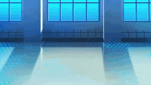 a room with a lot of windows and a fence in the background