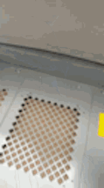 a close up of a microwave oven with a yellow sticker on it