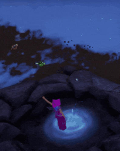 a blue light is shining on a rock in a dark area