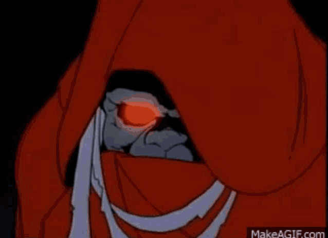 a close up of a person 's face in a dark room with a red background