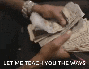 a person is holding a bunch of money in their hands .