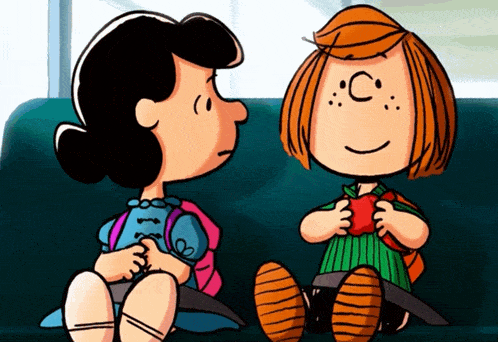 a cartoon of lucy and patty from peanuts sitting next to each other on a couch