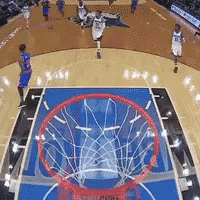 a basketball game is being played on a court with a hoop that says ' nba ' on it