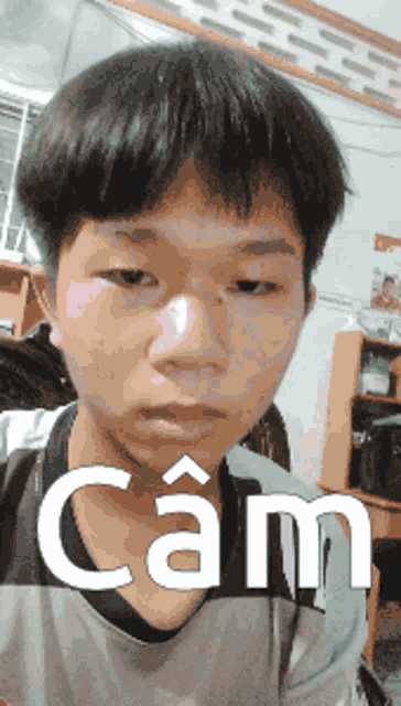 a young man is wearing a cam shirt