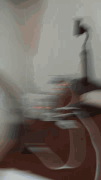 a blurred image of a person 's face with a red light coming out of it