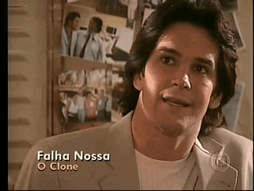 a man in a suit and white shirt with the name falha nossa o clone on the bottom