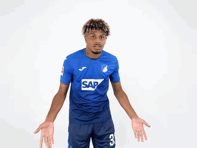 a soccer player wearing a blue shirt with the word sap on it