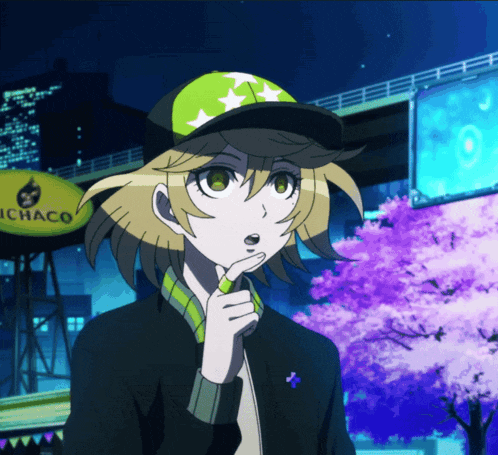 a girl wearing a green hat stands in front of an ichaco sign