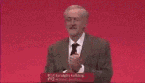 a man in a suit and tie is standing at a podium that says straight talking