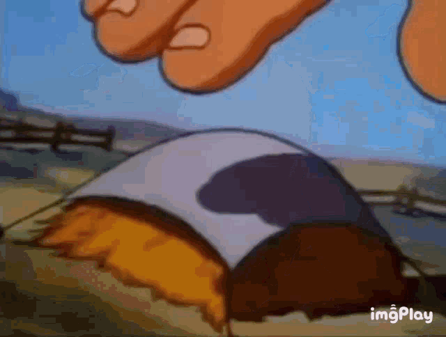a close up of a cartoon character 's feet standing next to a tent .