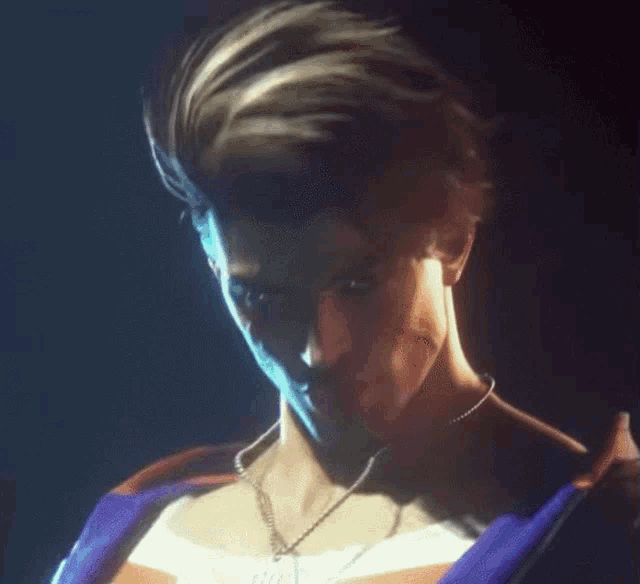 a man with a necklace around his neck is looking at the camera