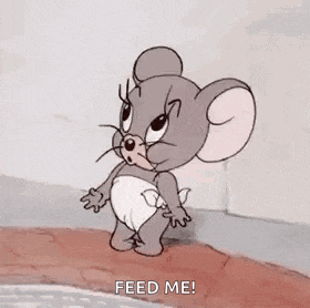 a cartoon mouse in a diaper is yawning and says `` feed me '' .