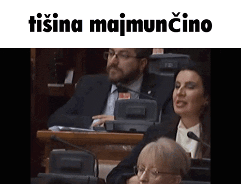 a man and a woman sitting in front of microphones with the words tisina majmuncino