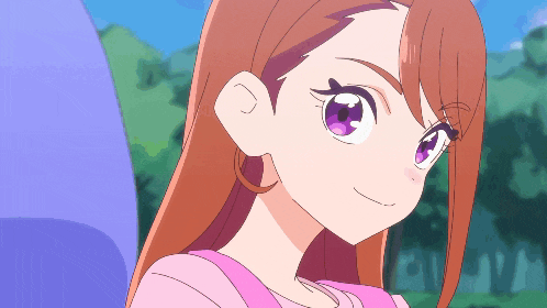 a girl with brown hair and purple eyes is smiling