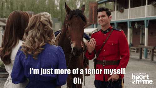 a man in a red uniform is standing next to a horse and says i 'm just more of a tenor myself