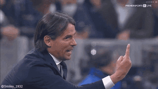 a man giving the middle finger during a premier sports 1 live