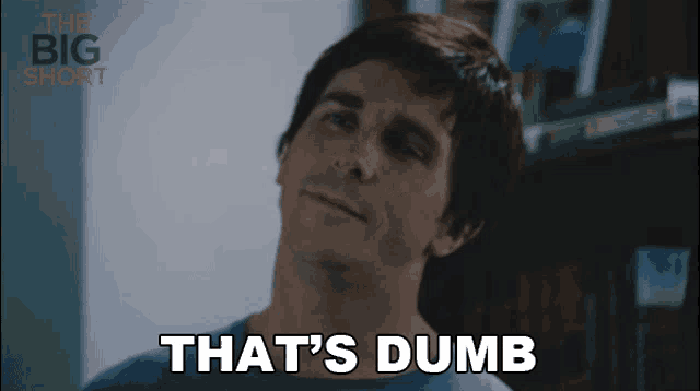 a man says " that 's dumb " in front of a big short logo