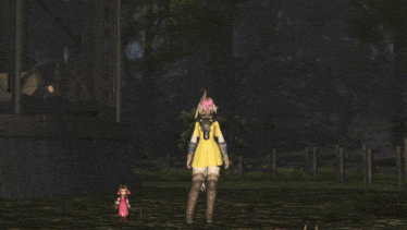 a woman in a yellow dress is standing next to a smaller doll