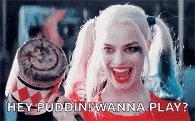 harley quinn from the movie suicide squad is smiling while holding a microphone and a cup of coffee .