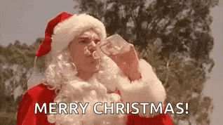 a man dressed as santa claus is drinking water from a bottle and saying merry christmas .