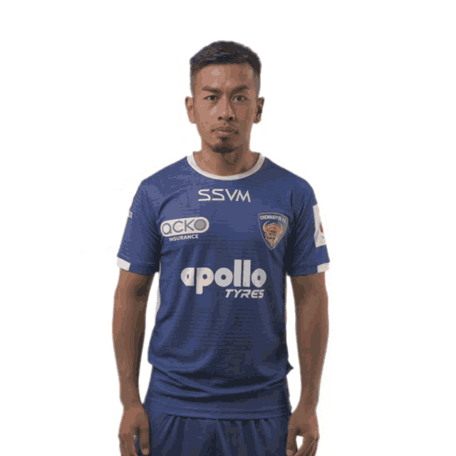 a man wearing a blue jersey with apollo tyres on it