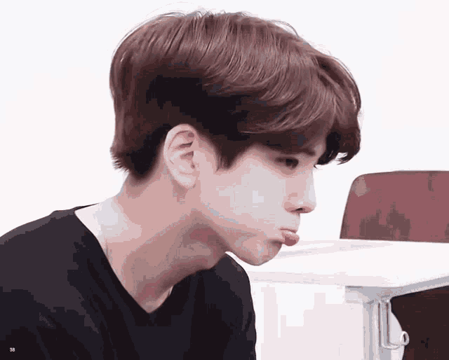 a close up of a person making a funny face with their mouth open