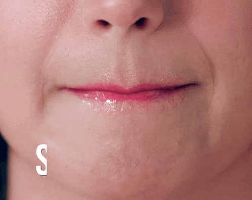 a close up of a woman 's mouth with the words stick i on the bottom