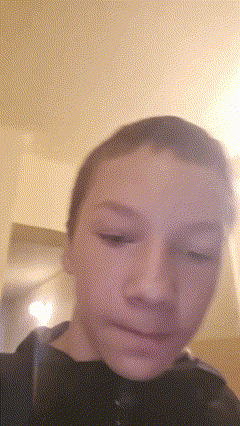 a close up of a person 's face with a blurred background
