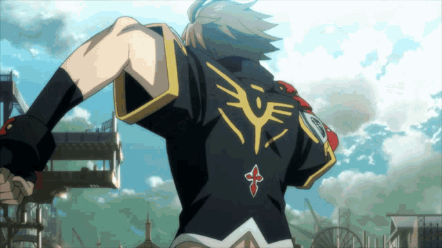 a person in a black shirt with a cross on the back