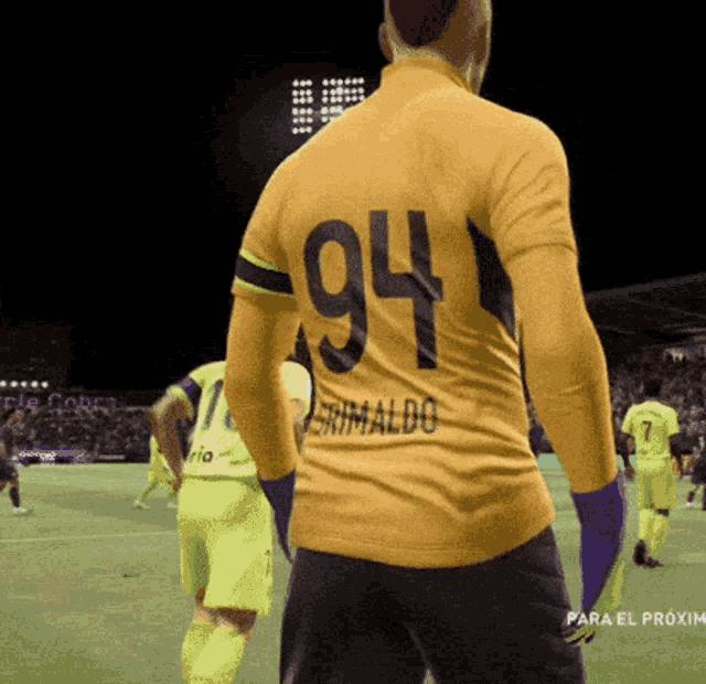 a soccer player wearing a yellow jersey with the number 94 on it