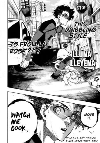 a soccer player is dribbling a soccer ball down a street while a cat looks on .