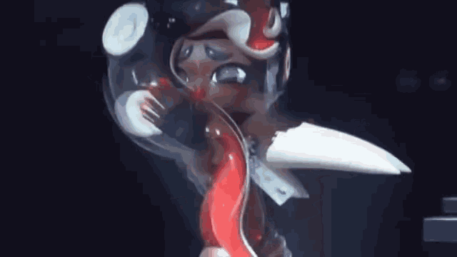 a close up of a cartoon character with a red and white squid coming out of its mouth .