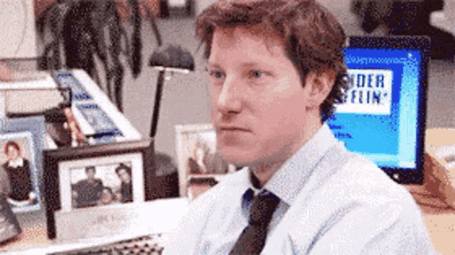a man sits at a desk in front of a computer screen that says ' spider flint ' on it