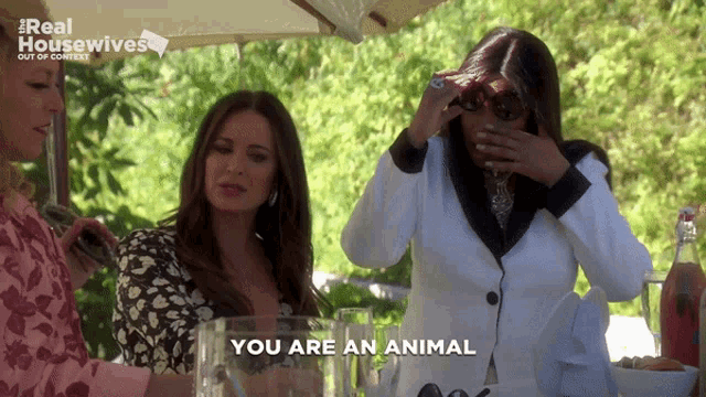 a woman says you are an animal while covering her face